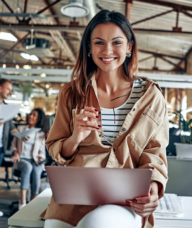 Group of young multiracial business people are working in modern office. Freelancers in coworking place. Creative and stylish youth.